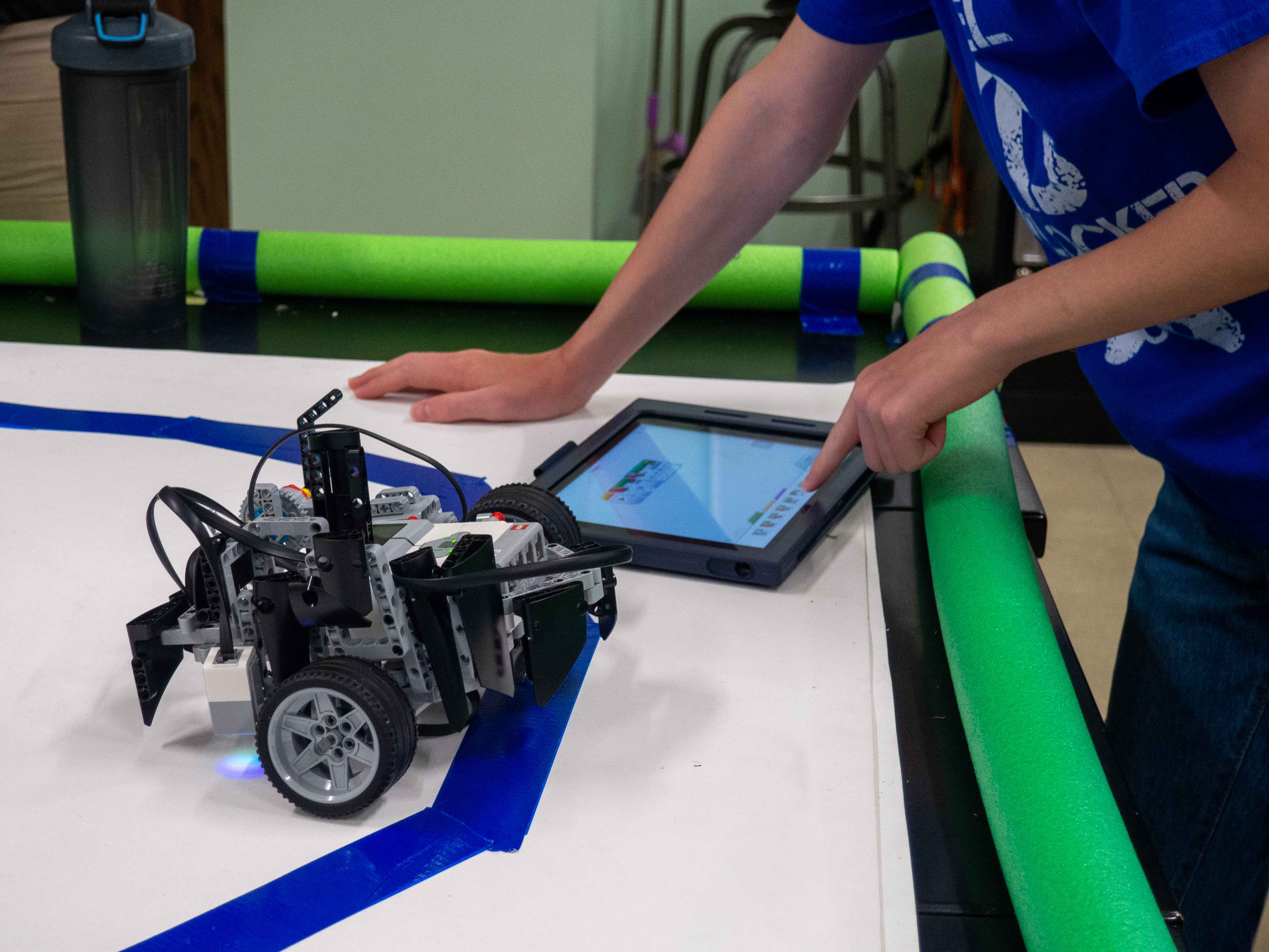 Student working with a robot