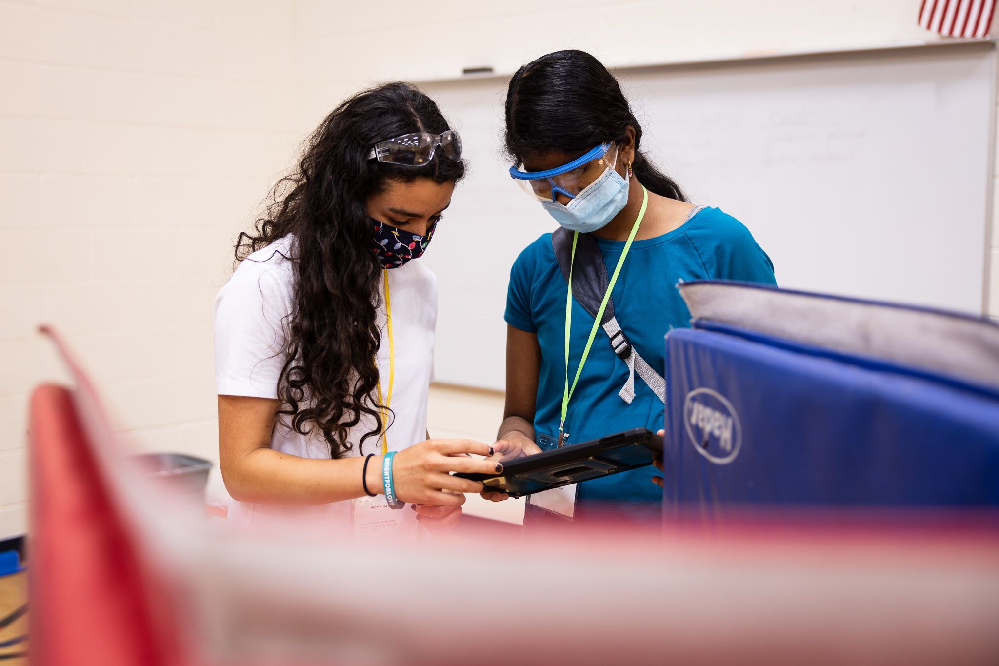 Two students working on a STEM project on their iPad