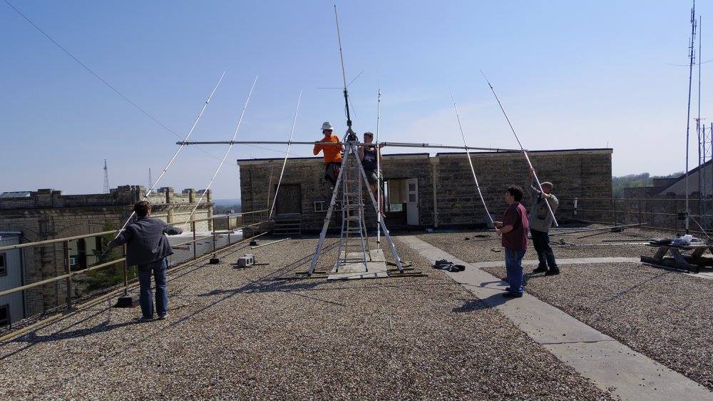 A small group installing a beam antennt to the club tower