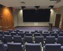 Lectern and big screen inside Davis Theatre